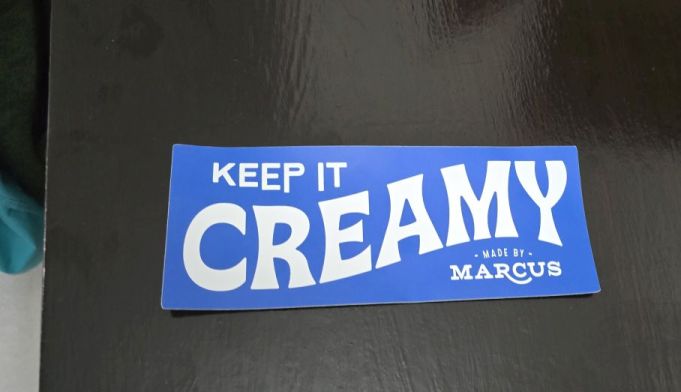 A custom sticker with the words "Keep It Creamy".