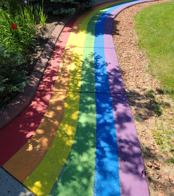 A rainbow painted Pride themed walkway in Sylvan Lake, AB